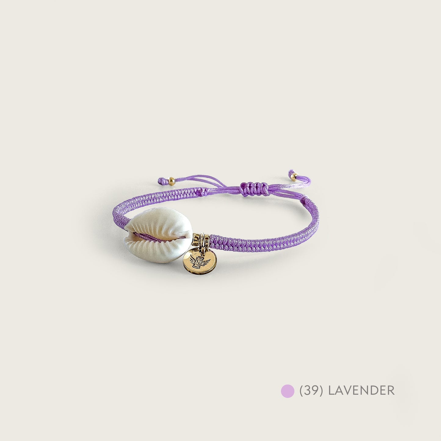 PULSERA TEJIDA CONCHA CAURI
